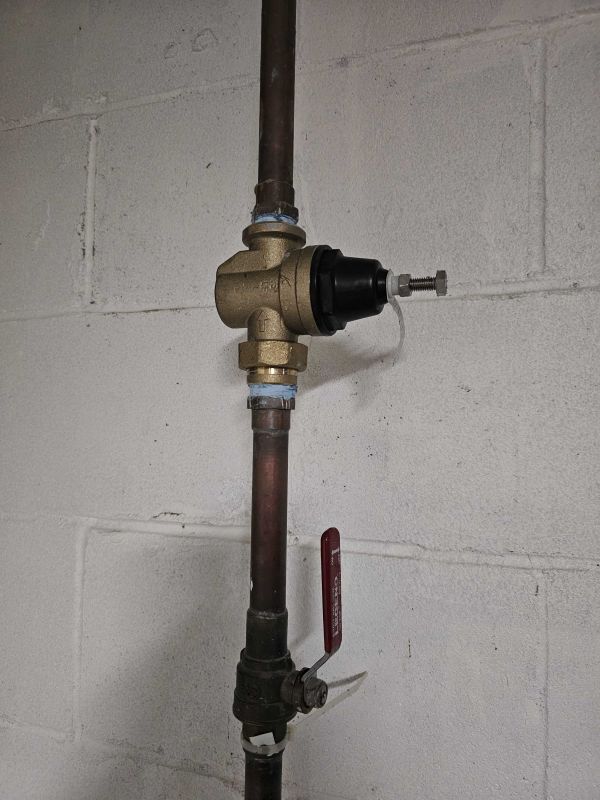 Technician Performing Backflow Test